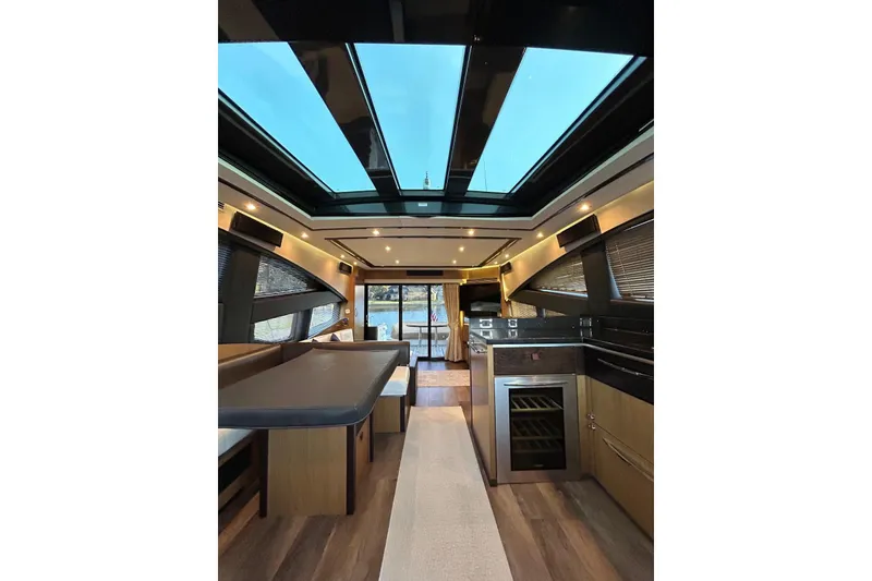 Slide: The Image of Luxurious interior of 2016 Sea Ray L650 yacht with skylight and modern furnishings. - 13