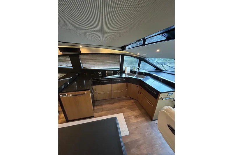 Slide: The Image of Luxurious interior of 2016 Sea Ray L650 yacht with modern kitchen design. - 18