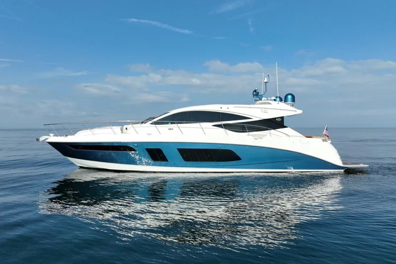 Slide: The Image of 2016 Sea Ray L650 yacht cruising on calm ocean waters under a clear blue sky. - 2