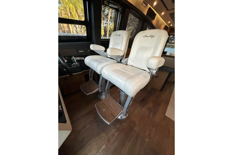 Slide: The Image of Luxurious white captain chairs in 2016 Sea Ray L650 yacht interior. - 23