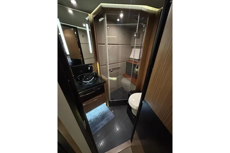 Slide: The Image of Luxurious bathroom in 2016 Sea Ray L650 yacht with modern fixtures and elegant design. - 26