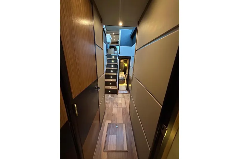 Slide: The Image of Luxurious interior hallway of 2016 Sea Ray L650 yacht with modern wood paneling. - 28