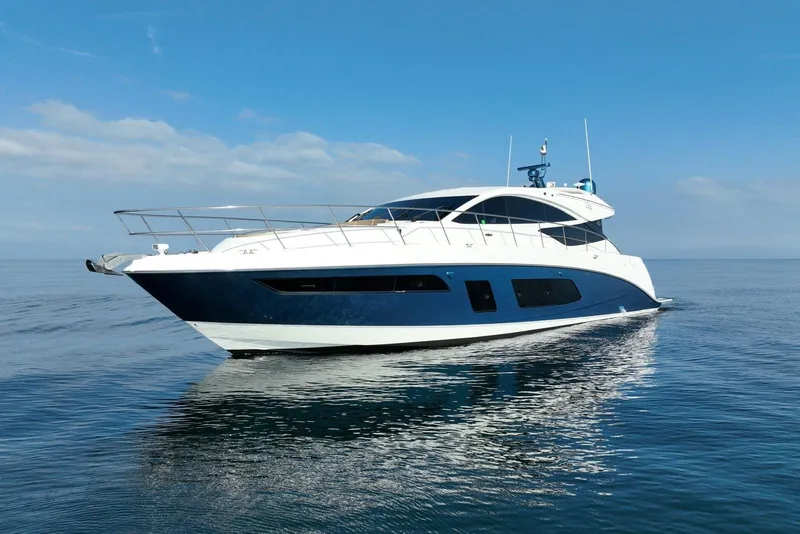 Slide: The Image of 2016 Sea Ray L650 yacht cruising on calm ocean waters under a clear blue sky. - 3