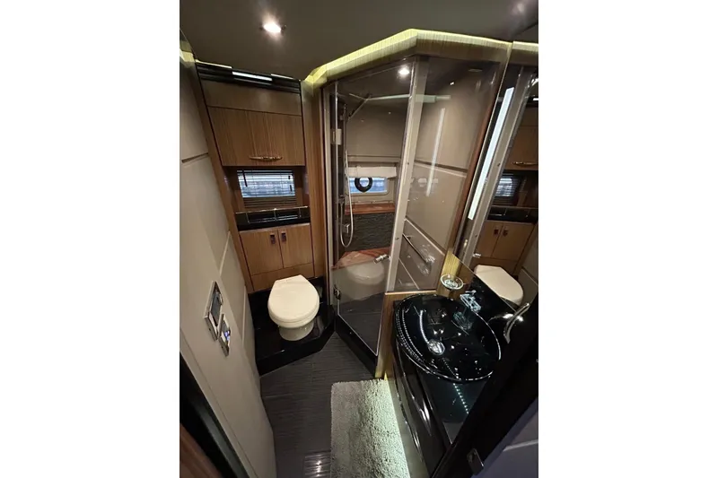 Slide: The Image of Luxurious bathroom in 2016 Sea Ray L650 yacht with modern fixtures and elegant design. - 30