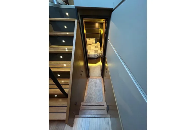 Slide: The Image of Staircase leading to a cozy cabin in a 2016 Sea Ray L650 yacht. - 34