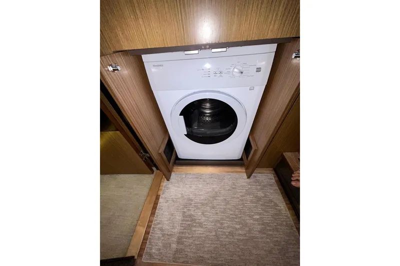 Slide: The Image of Washing machine in 2016 Sea Ray L650 yacht's wooden interior compartment. - 37
