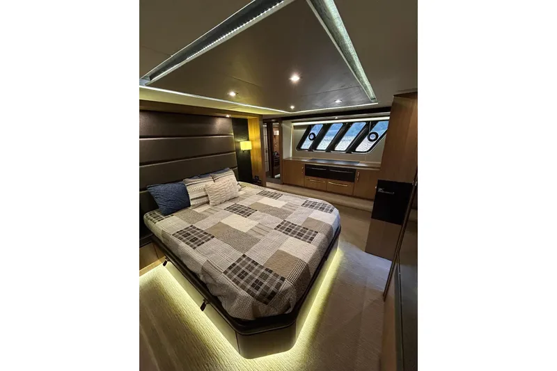 Slide: The Image of Luxurious 2016 Sea Ray L650 yacht bedroom with modern design and ambient lighting. - 38
