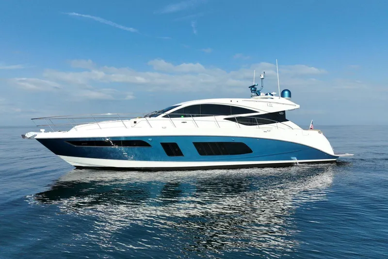 Slide: The Image of 2016 Sea Ray L650 yacht cruising on calm ocean waters under a clear blue sky. - 4