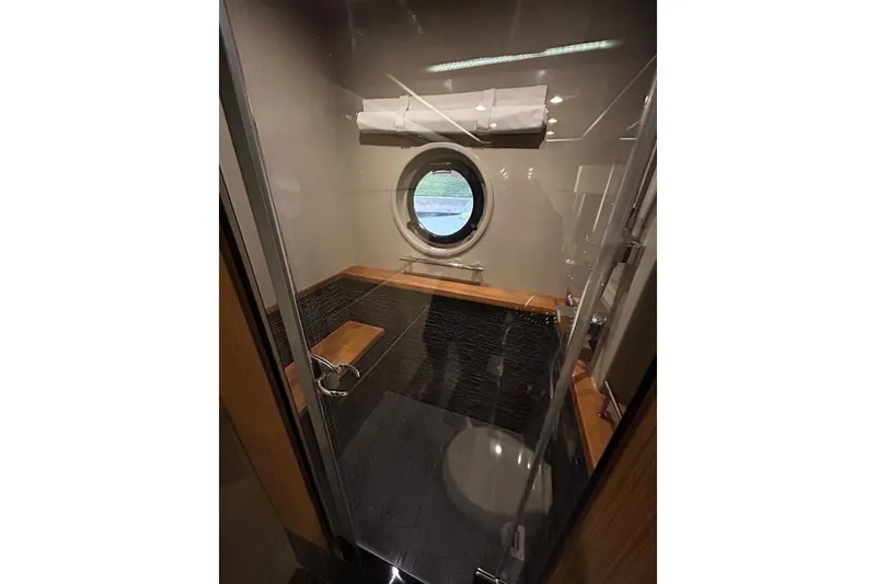 Slide: The Image of Luxurious bathroom interior of 2016 Sea Ray L650 yacht with porthole window. - 43