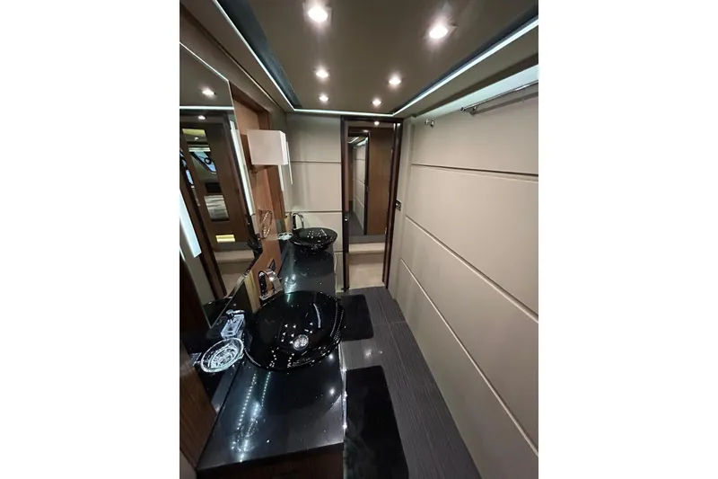 Slide: The Image of Luxurious bathroom interior of 2016 Sea Ray L650 yacht with modern fixtures and lighting. - 44