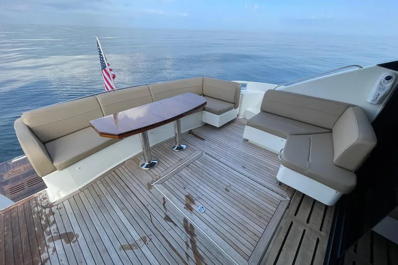 Slide: The Image of Luxurious 2016 Sea Ray L650 yacht deck with seating and ocean view. - 47
