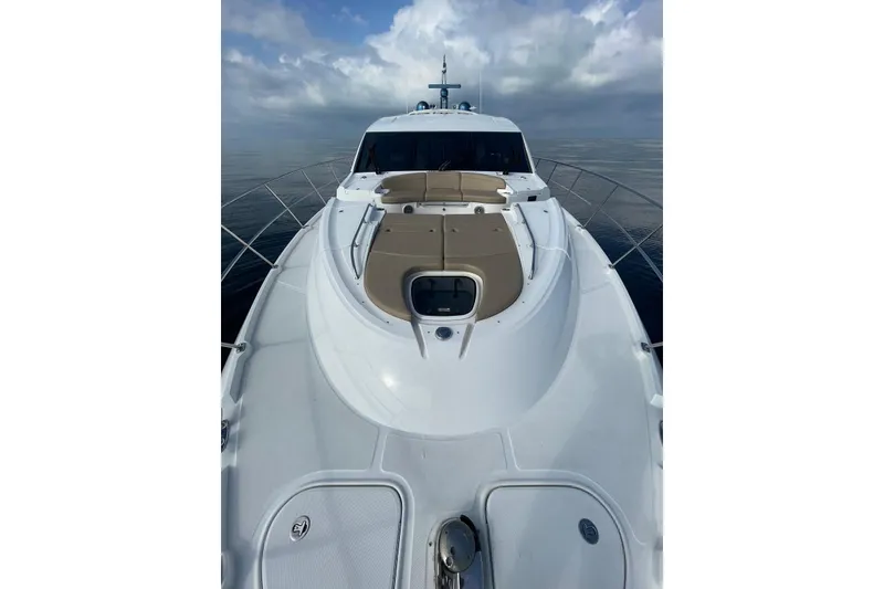 Slide: The Image of 2016 Sea Ray L650 yacht on calm waters under cloudy sky. - 54