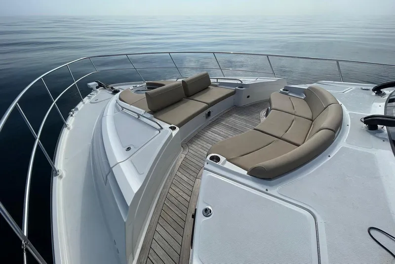 Slide: The Image of Luxurious 2016 Sea Ray L650 yacht deck with elegant seating and ocean view. - 56