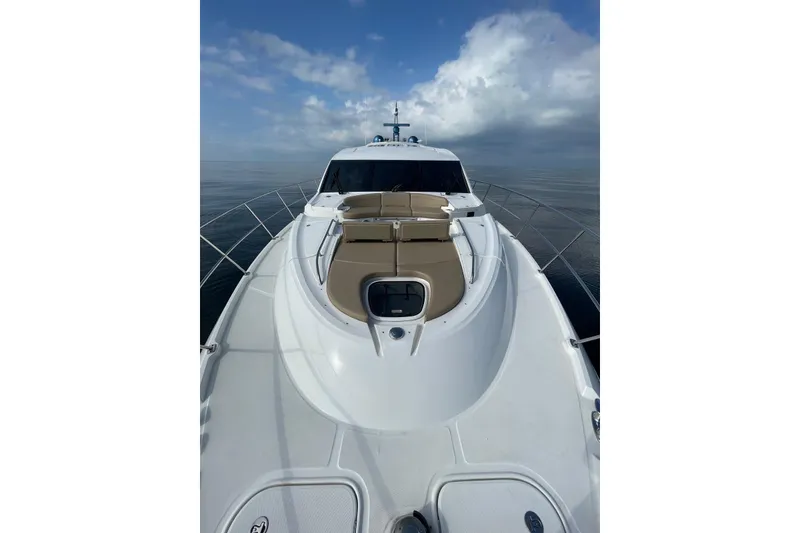 Slide: The Image of 2016 Sea Ray L650 yacht on calm ocean with cloudy sky. - 57