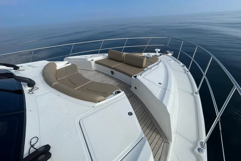 Slide: The Image of Luxurious 2016 Sea Ray L650 yacht deck with elegant seating and ocean view. - 58