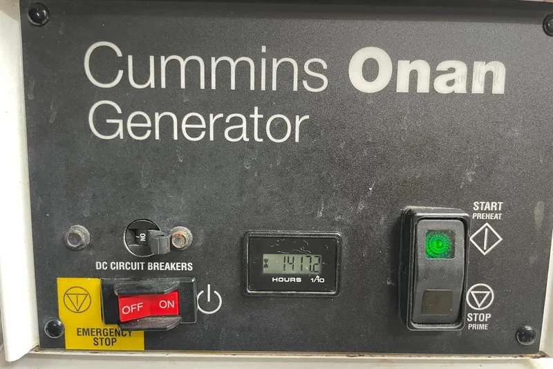 Slide: The Image of Cummins Onan generator control panel on a 2016 Sea Ray L650 yacht. - 59