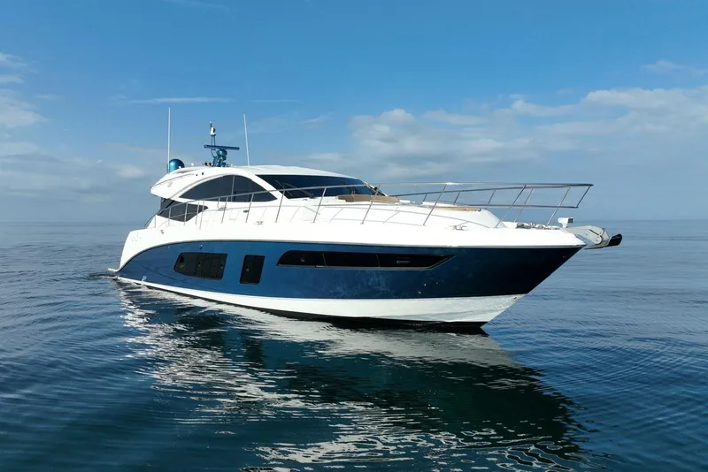 Slide: The Image of 2016 Sea Ray L650 yacht on calm ocean under blue sky. - 6