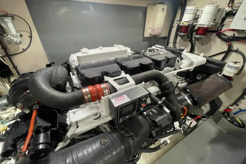 Slide: The Image of Engine room of 2016 Sea Ray L650 yacht, showcasing a powerful marine engine. - 60