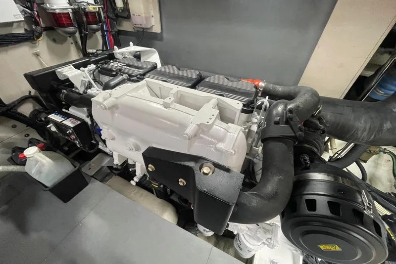 Slide: The Image of Engine room of 2016 Sea Ray L650 yacht, showcasing detailed machinery and components. - 61