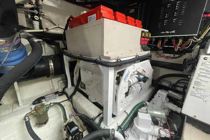 Slide: The Image of Engine room of 2016 Sea Ray L650 yacht with electrical components and wiring. - 63