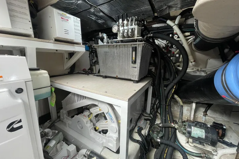 Slide: The Image of Engine room of 2016 Sea Ray L650 yacht with Cummins equipment and complex wiring. - 67