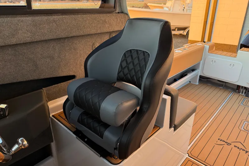 Slide: The Image of Luxurious seating in 2026 Makaira Gen3 26 Outboard boat, featuring quilted upholstery. - 19