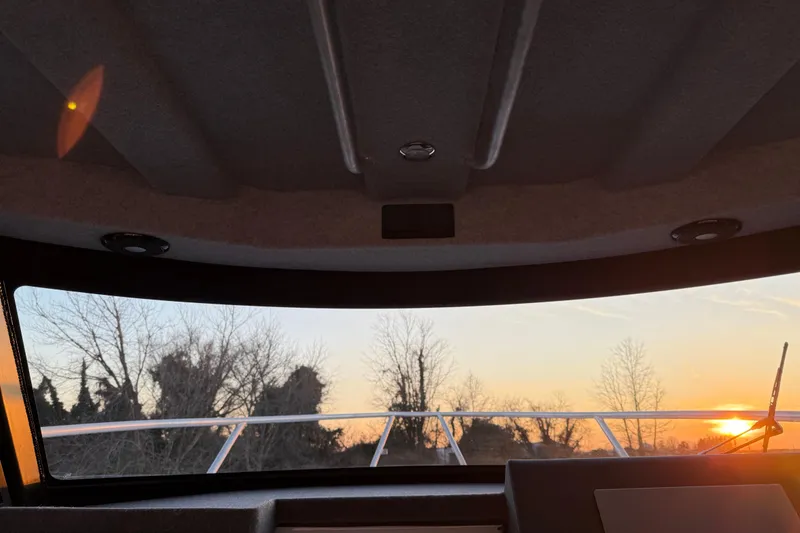 Slide: The Image of Interior view of Makaira Gen3 26 Outboard boat at sunset, 2026 model. - 22