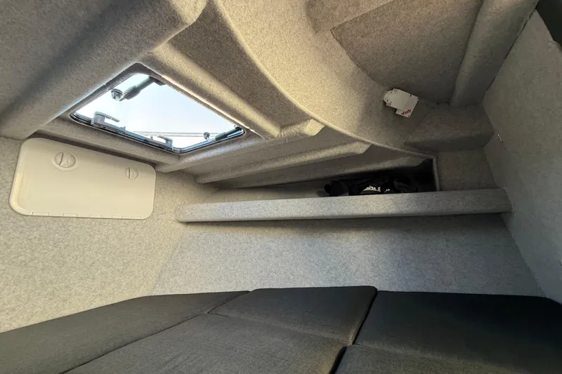 Slide: The Image of Interior cabin of 2026 Makaira Gen3 26 Outboard boat with window and storage. - 31