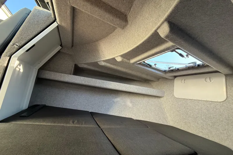 Slide: The Image of Interior cabin of 2026 Makaira Gen3 26 Outboard boat, featuring modern design and comfortable seating. - 32