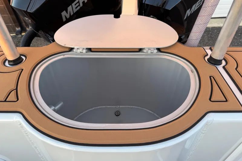 Slide: The Image of Livewell compartment on 2026 Makaira Gen3 26 Outboard boat, featuring a sleek design. - 36