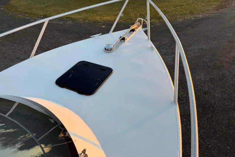 Slide: The Image of Bow of 2026 Makaira Gen3 26 Outboard boat with hatch and railing. - 38