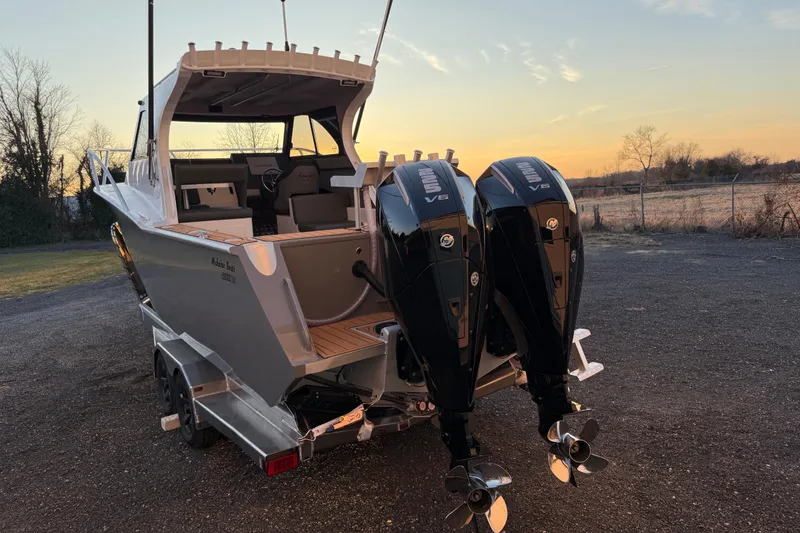 Slide: The Image of 2026 Makaira Gen3 26 Outboard boat with dual engines at sunset. - 46