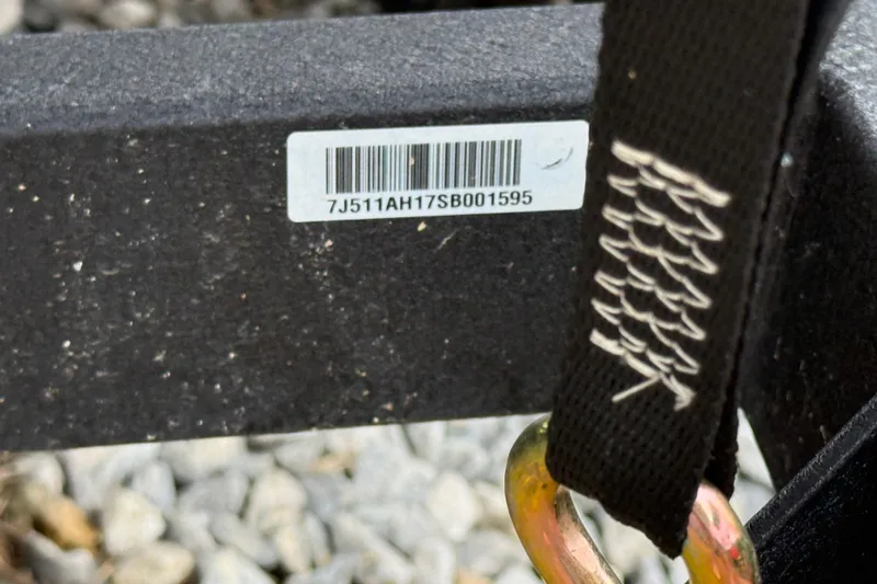 Slide: The Image of Barcode and strap detail on 2025 Tracker Bass Tracker Classic XL boat trailer. - 10