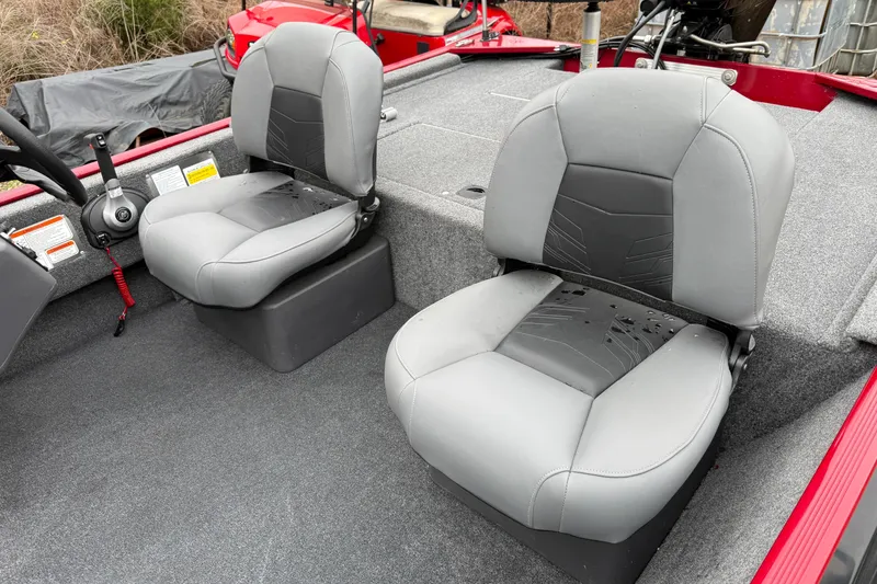 Slide: The Image of 2025 Tracker Bass Tracker Classic XL boat interior with two gray seats. - 2