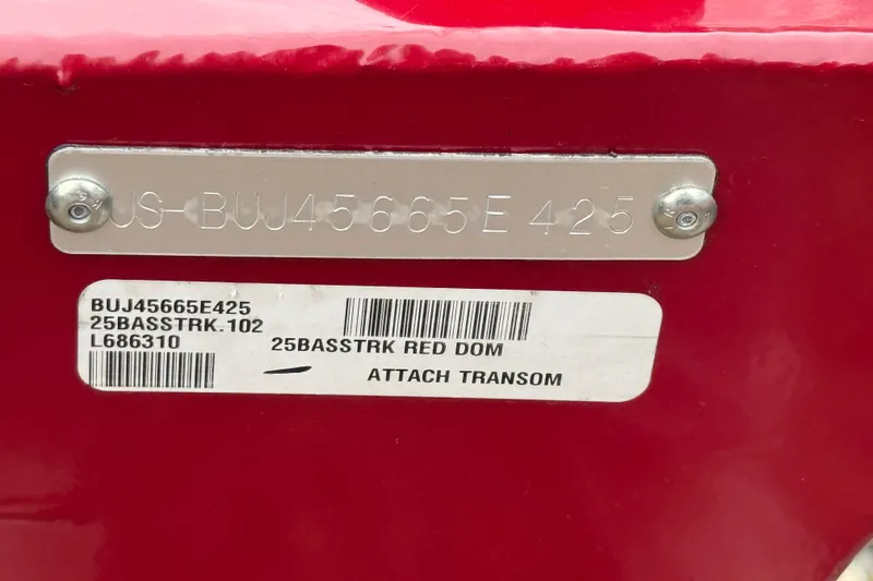 Slide: The Image of 2025 Tracker Bass Tracker Classic XL hull identification number on red surface. - 9