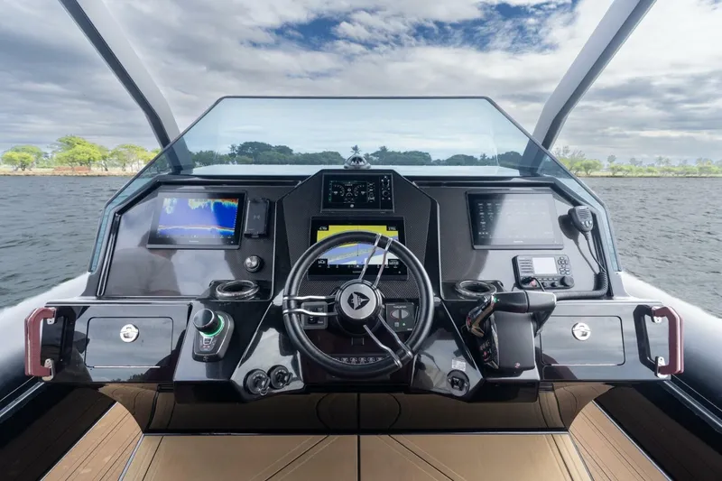 Slide: The Image of Cockpit of 2023 Skipper-BSK 42 boat with advanced navigation systems and steering wheel. - 14