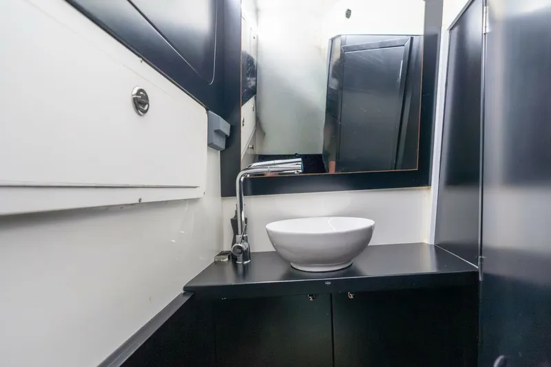 Slide: The Image of Modern bathroom interior in 2023 Skipper-BSK 42 yacht, featuring sleek sink and mirror. - 16