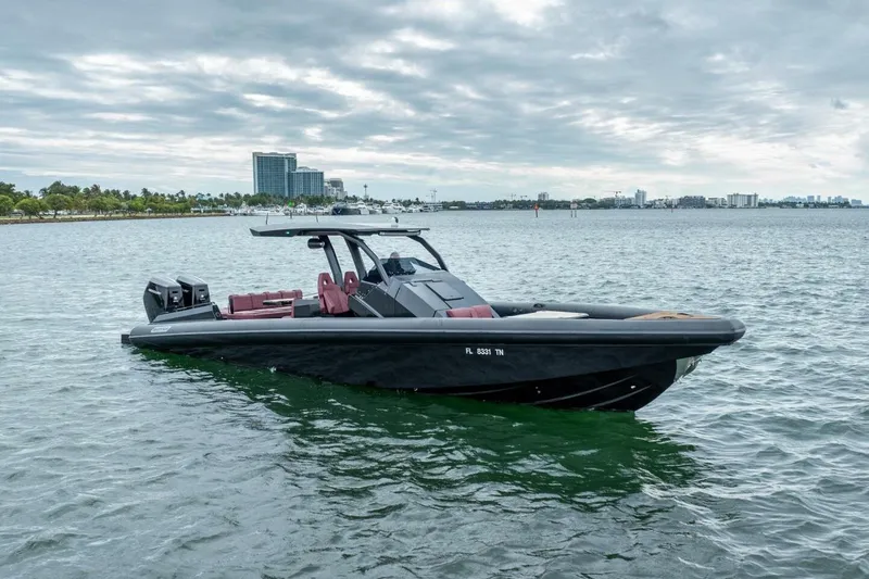 Slide: The Image of 2023 Skipper-BSK 42 boat on water with city skyline in background. - 4