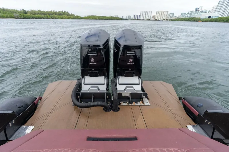 Slide: The Image of 2023 Skipper-BSK 42 boat with dual outboard engines on water. - 6