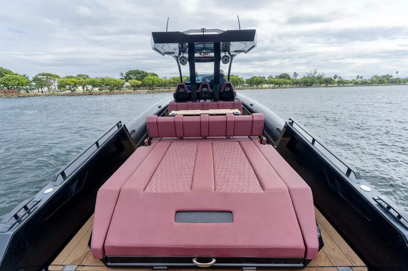 Slide: The Image of 2023 Skipper-BSK 42 boat with luxurious seating, cruising on calm waters. - 7