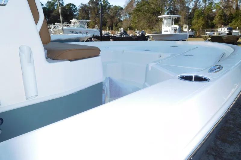 Slide: The Image of 2026 Skeeter SX221 boat with sleek white deck and comfortable seating. - 2