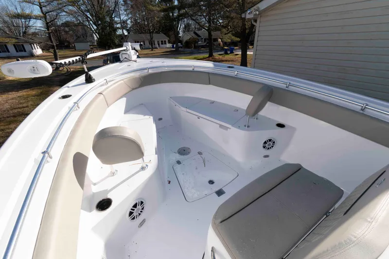 Slide: The Image of 2024 Sportsman Open 252 Center Console boat interior with seating and storage compartments. - 10