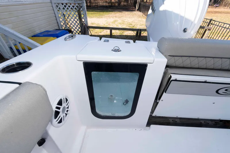 Slide: The Image of 2024 Sportsman Open 252 Center Console boat interior with seating and storage. - 14