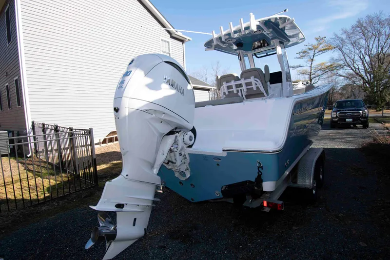 Slide: The Image of 2024 Sportsman Open 252 Center Console boat with Yamaha engine on trailer. - 18