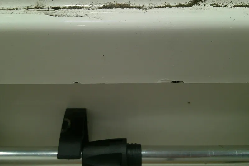 Slide: The Image of Cracked white surface with metal rod, Tahoe T21, 2025 model. - 11