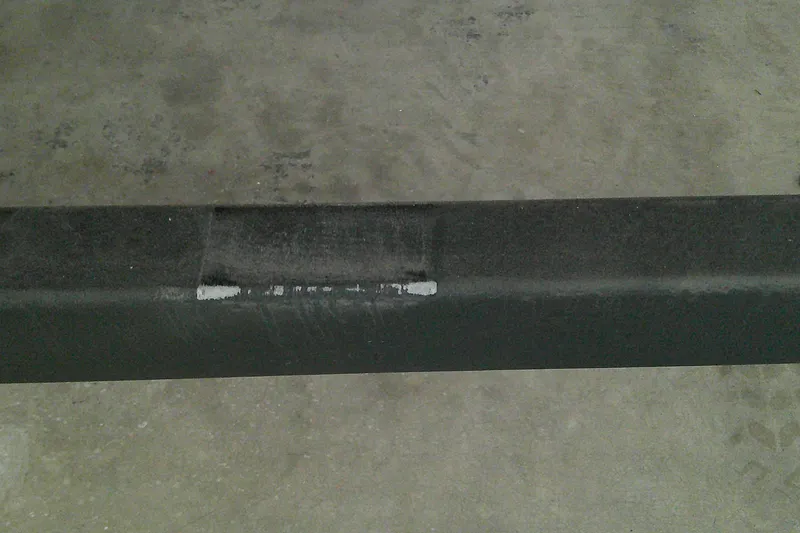 Slide: The Image of Damaged bumper of 2025 Tahoe T21 on concrete floor. - 12