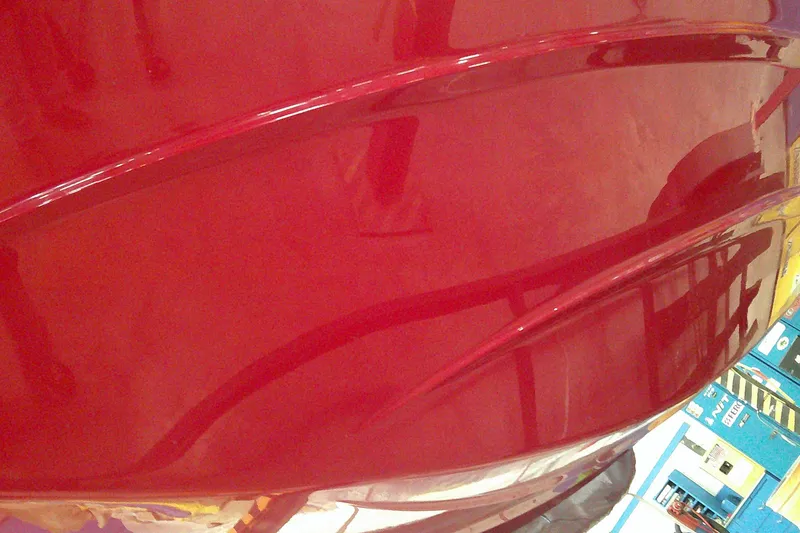 Slide: The Image of Red Tahoe T21 2025 boat hull with glossy finish and sleek design. - 13