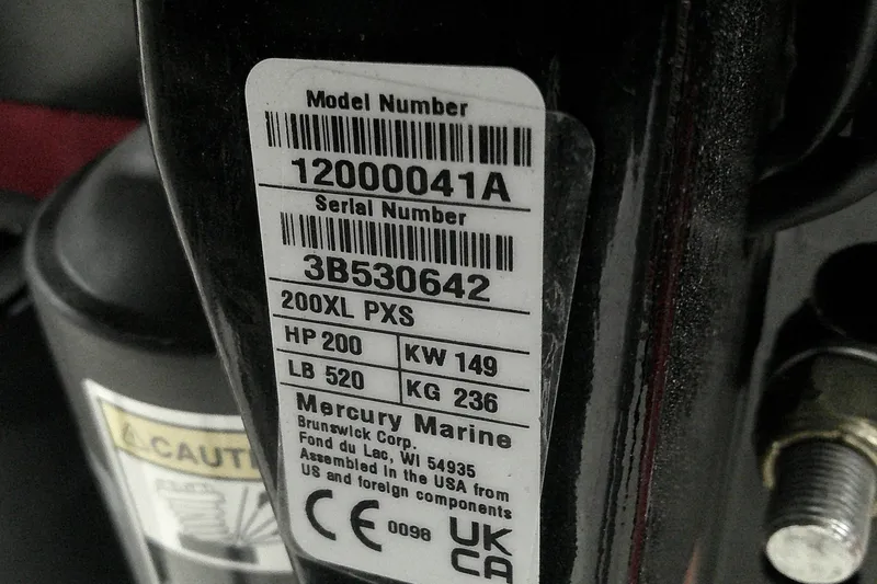 Slide: The Image of Label on Mercury Marine engine, showing model and serial numbers, specifications, and compliance details. - 15