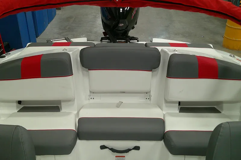 Slide: The Image of 2025 Tahoe T21 boat interior with gray and red seating, showcasing modern design. - 5