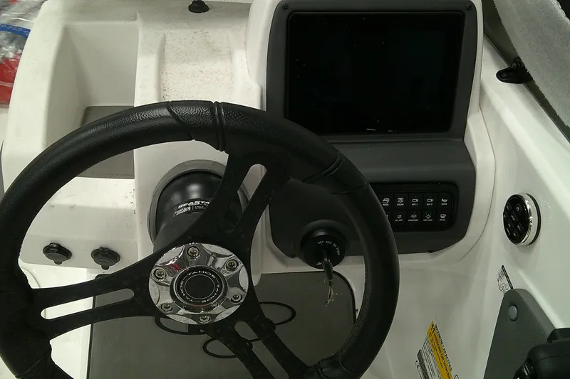 Slide: The Image of Steering wheel and dashboard of 2025 Tahoe T21 boat with control panel. - 8